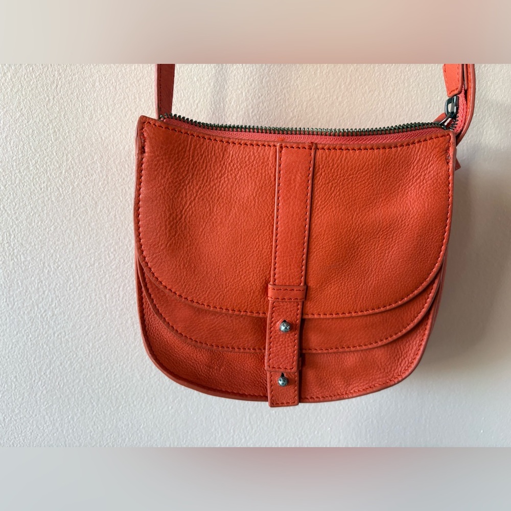 Lucky Brand Orange Leather Crossbody Bag with Multiple Pockets.